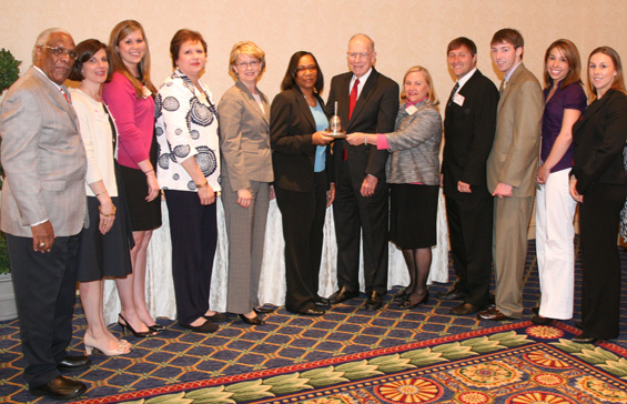 Accepting the award on behalf of the Healthy Campus/Community Initiative from Governor William Winter were Maurice Lucas, CSD Board Member, Lyn Hubbard, Healthy Schools Coordinator, Leigh Pickard, HCCI Coordinator, Dr. Leslie Griffin, dean of the College of Education, Sheila Grogan, Executive Director of the Blue Cross and Blue Shield of Mississippi Foundation, Dr. Jackie Thigpen, CSD Superintendent, Draughon McPherson, Delta State Nutrition Department, Kirk Mansell, Delta State Intramurals, Craig Warren, HCCI Graduate Assistant, Ashley Thompson, HCCI Graduate Assistant, and Karen Klintoe, HCCI Fitness Coordinator.